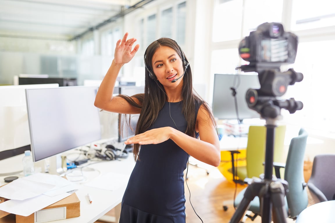 Business Woman with Headset Recording Video